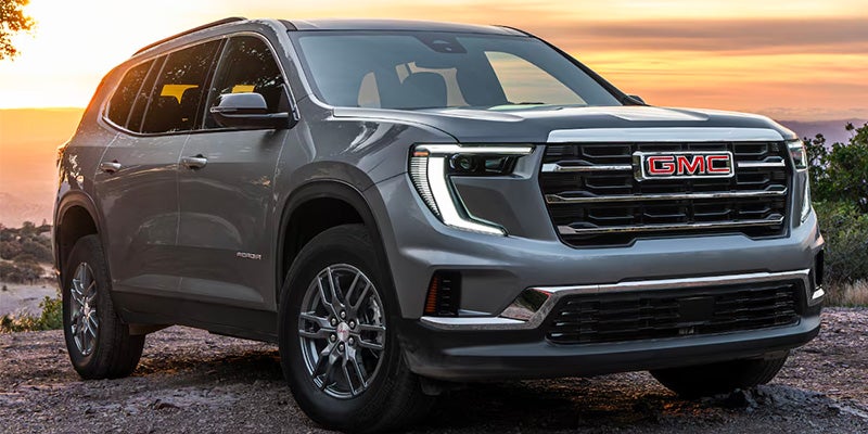 A gray suv sitting parked.