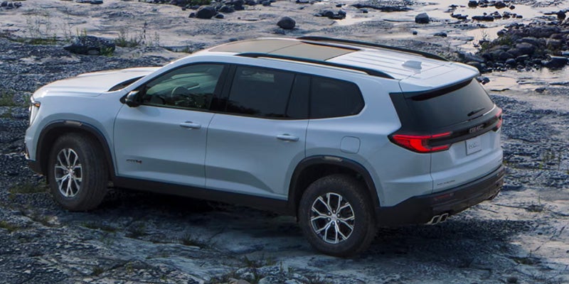 A white suv sitting parked.