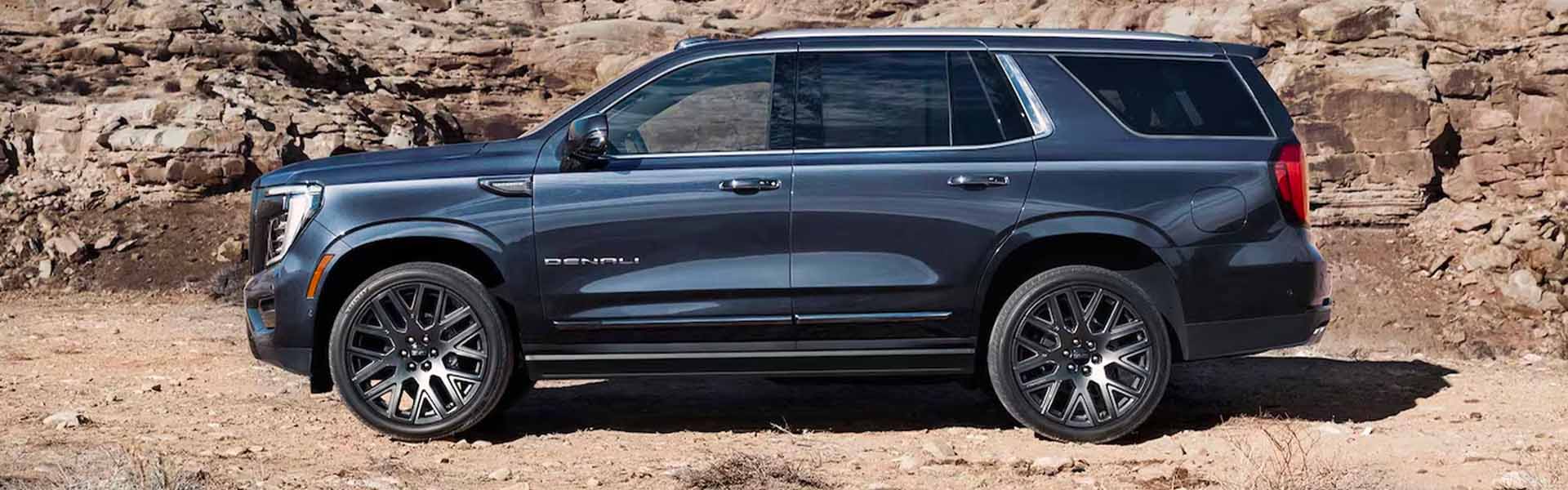 A black suv sitting parked.