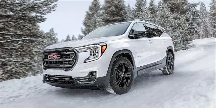 a 2024 gmc terrain driving in the snow
