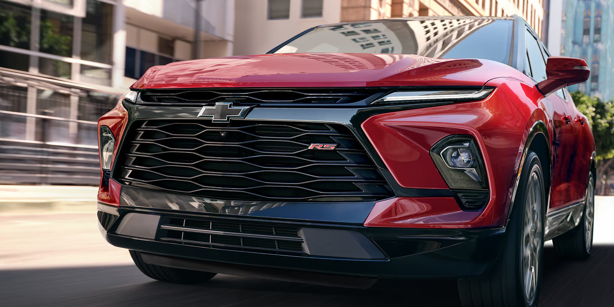 up close view of the grille and RS badging on a red 2025 chevrolet blazer