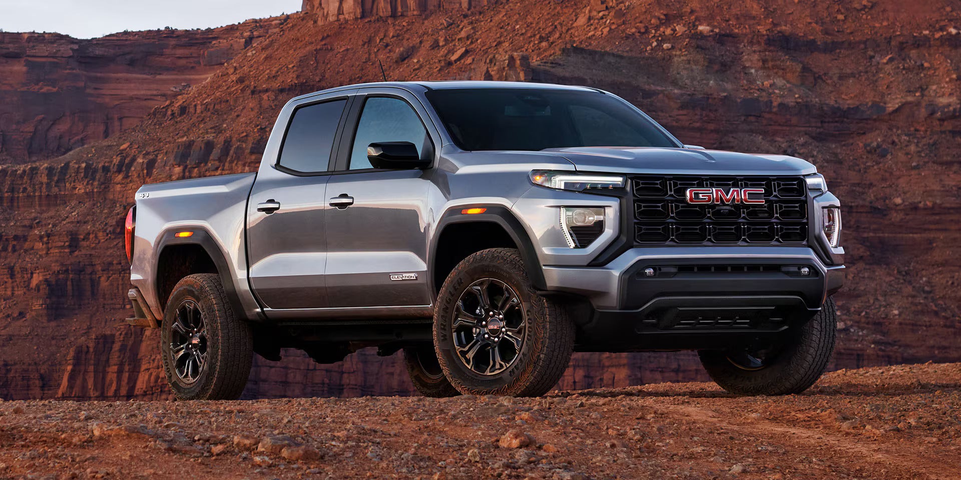 silver 2025 gmc canyon parked in the desert