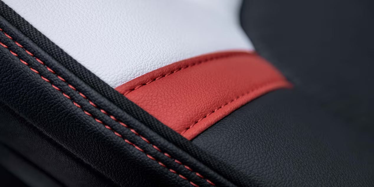 white, black and red leather interior with black and red stitching in the 2025 canyon