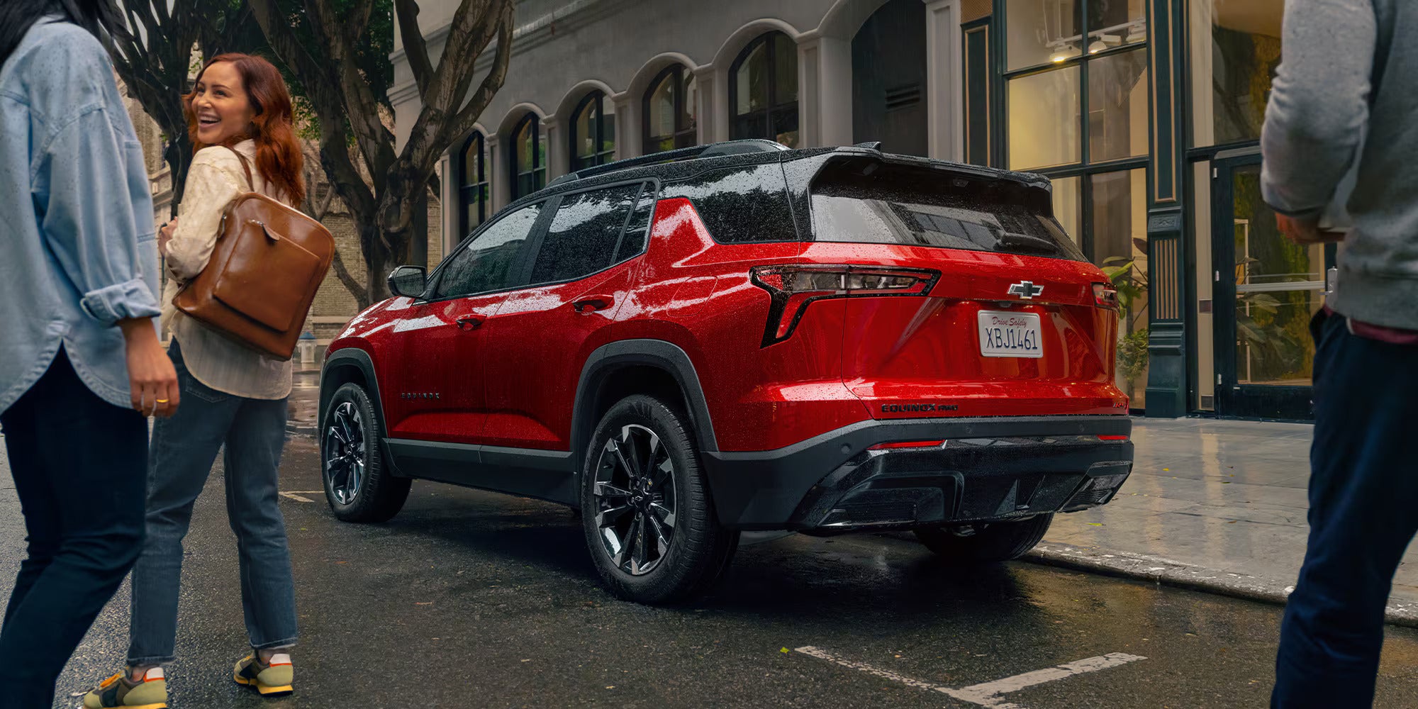 a red chevy equinox parked