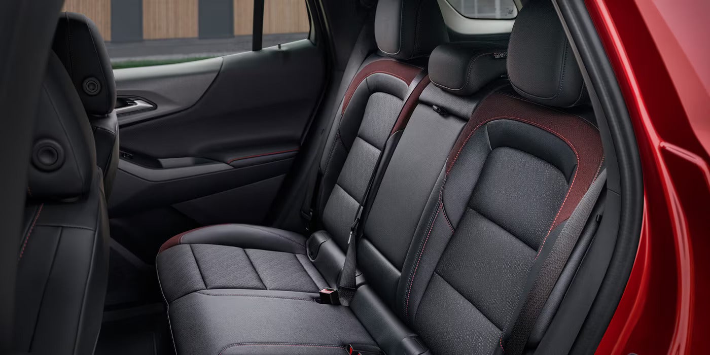 the backseats of a chevy equinox in black and red leather