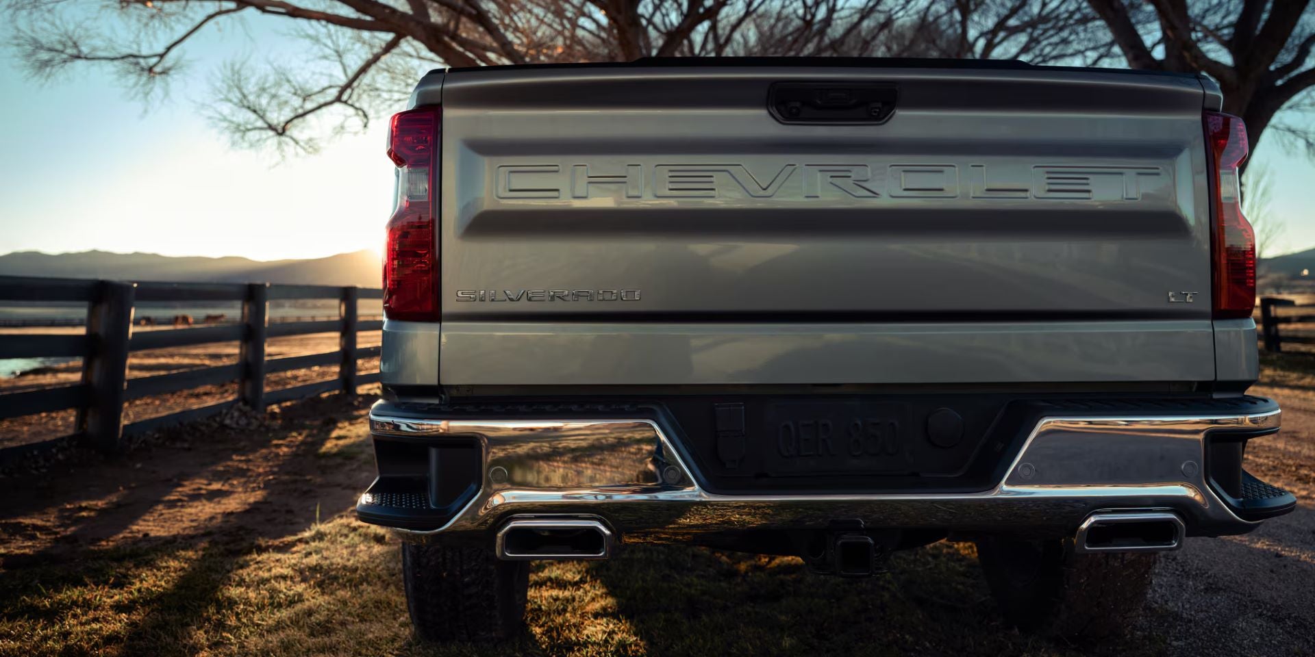 A close look at a silver trucks tailgate.