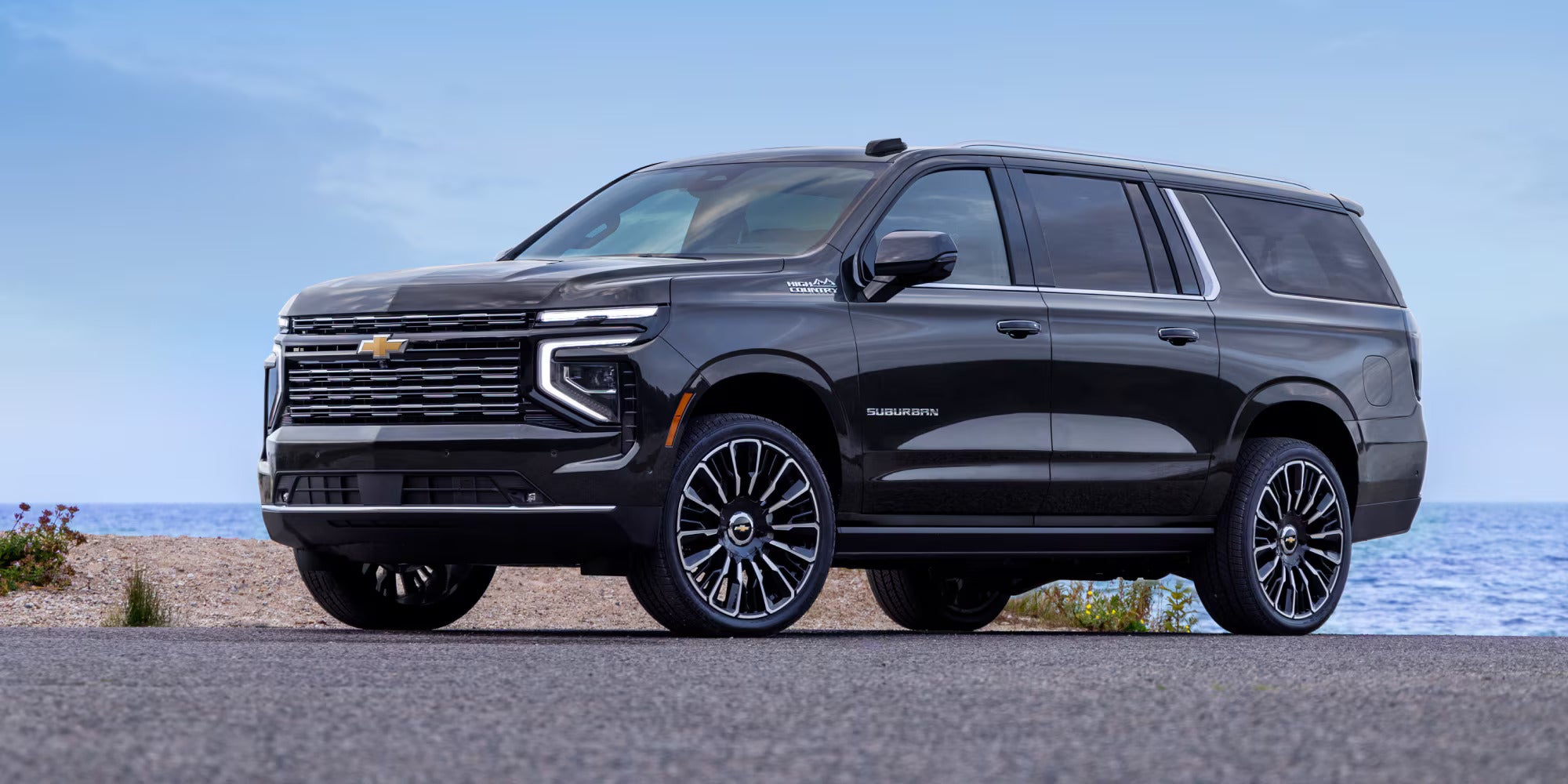 A black suv sitting parked.