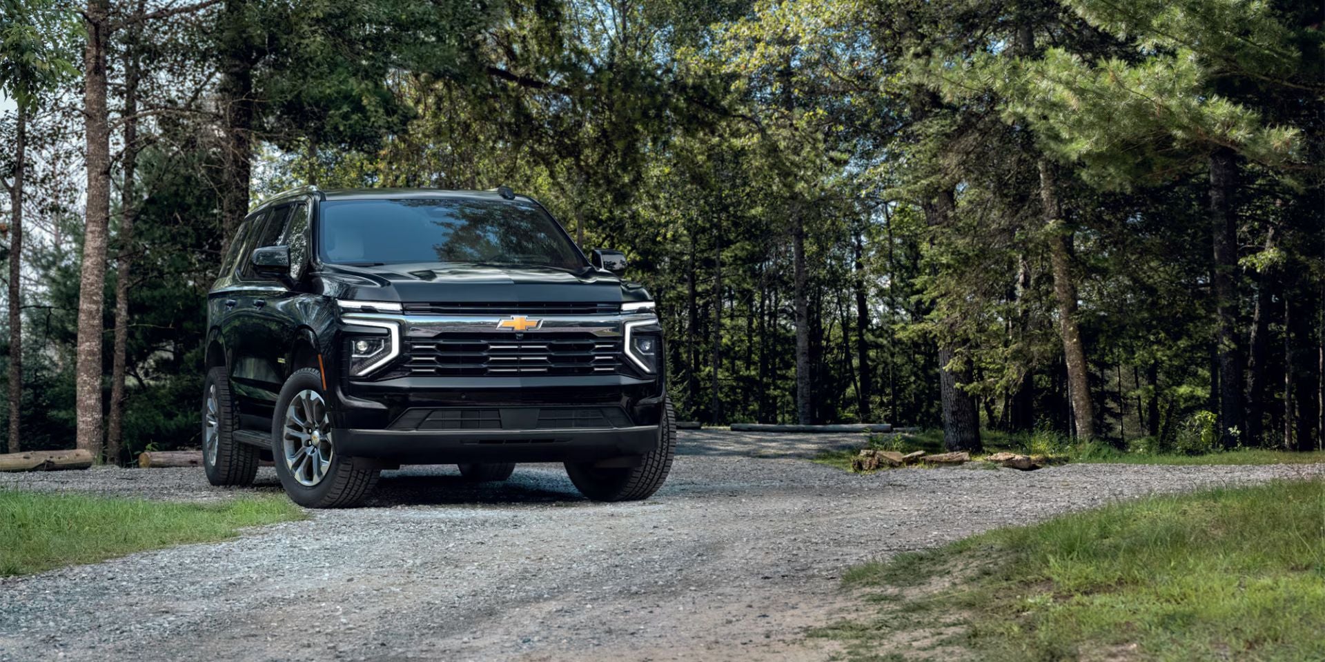 A black suv sitting parked.